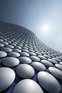 sun reflector covered high-rise building in low angle photography thumbnail