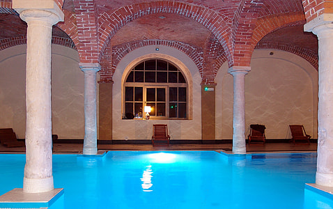 blue indoor pool during nighttime thumbnail