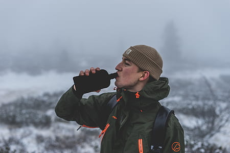 man drinking black bottle thumbnail