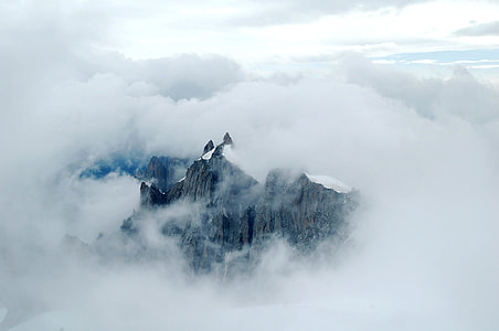 Mountain surrounded by snow and fug thumbnail