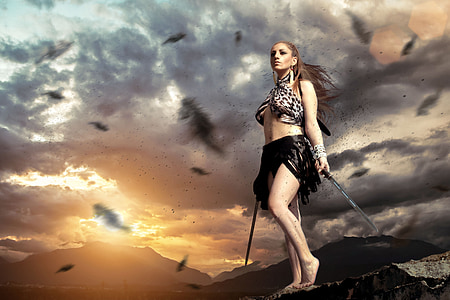 woman in black skirt holding two swords graphic wallpaper thumbnail