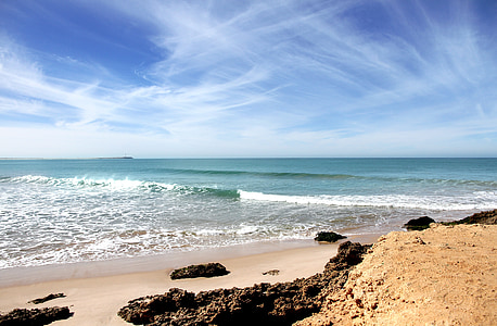 rocks on seashore and sea waves thumbnail