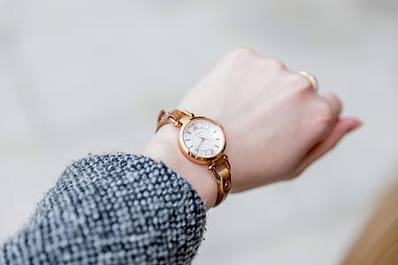 Woman with clock checks the time thumbnail