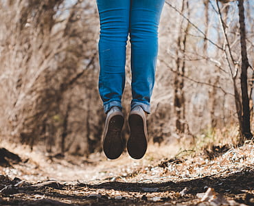 person jumping wearing blue jeans thumbnail
