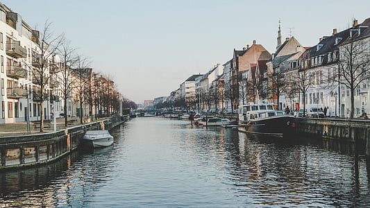 body of water surrounded by assorted-color houses thumbnail