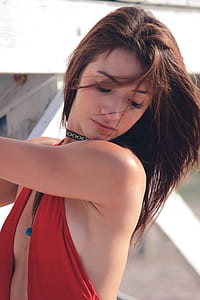 woman wearing red sleeveless top thumbnail