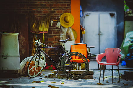 black and gray rigid bike beside armchair thumbnail