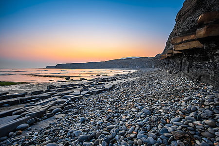 photography of stones near body of water thumbnail