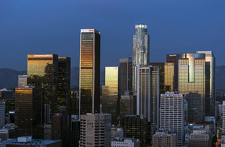concrete high-rise buildings under blue sky thumbnail