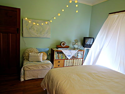 white bedspread in front of cubby shelf thumbnail