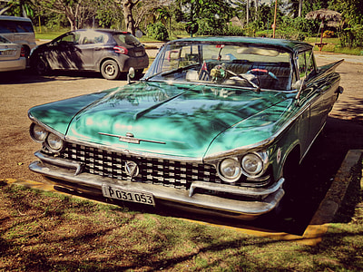 classic green car parked outdoor thumbnail