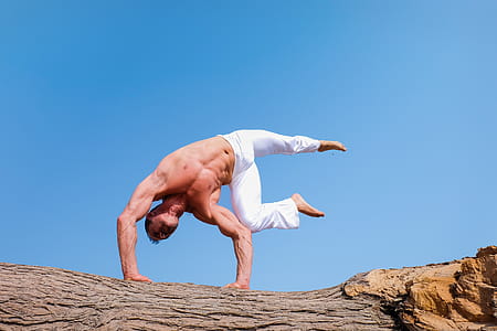 Man Wearing White Pants Under Blue Sky thumbnail