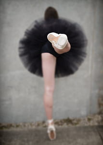 woman wearing black tutu skirt performing ballet dance thumbnail