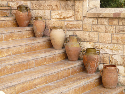 six brown clay pots on stairs thumbnail