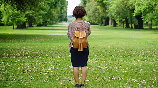 woman standing on green grass thumbnail