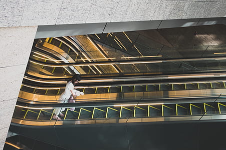 woman standing on escalator thumbnail