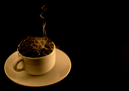 white cup on saucer at dark room thumbnail