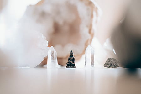 selective photo of black Buddha figurine thumbnail