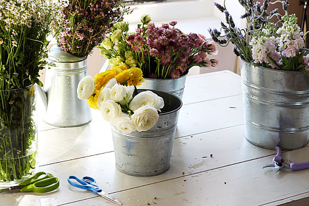 yellow and white flowers on stainless steel bucket thumbnail