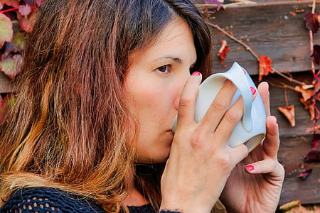 person drinking in white cup thumbnail