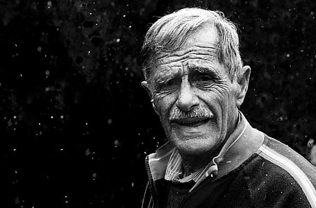 portrait photo of man with black background thumbnail