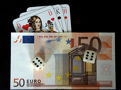 white dice on 50 euro banknote thumbnail