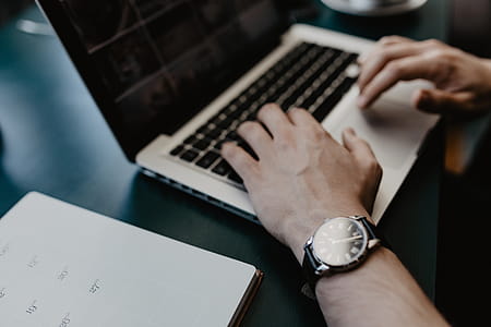 Male working with a laptop and a cup of coffee thumbnail