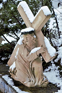 Jesus carrying cross statuette at daytime thumbnail