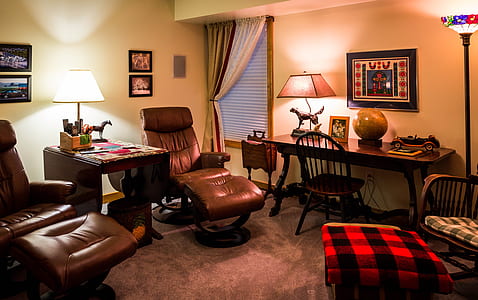 brown leather recliner beside wooden table thumbnail