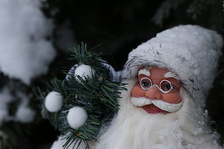 selective focus photography of Santa Claus figurine thumbnail