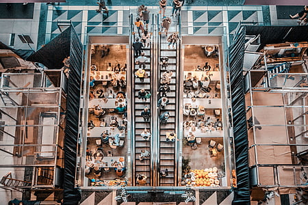 high-angle photo of people riding on escalator thumbnail