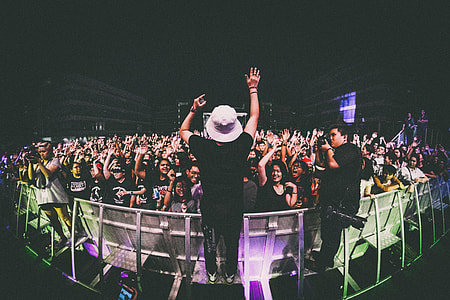 A man with crowd at a music concert thumbnail