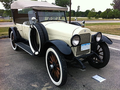 beige and black parked vehicle thumbnail