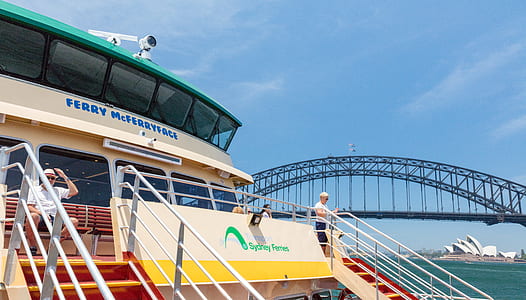 man riding on white and yellow ferry boat thumbnail
