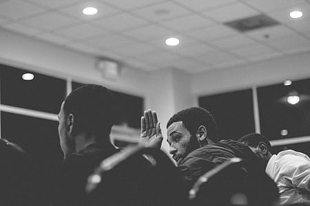 three men sitting on chair inside room thumbnail