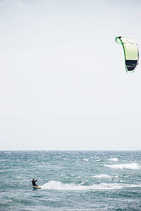 Surfboarding with surfing kite in the ocean thumbnail