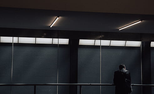 man leaning on steel frame thumbnail