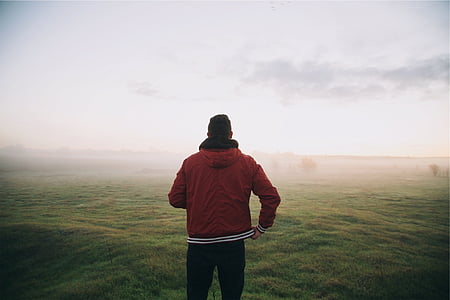 person standing on open field thumbnail