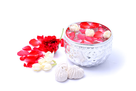 silver container filled with red petals thumbnail