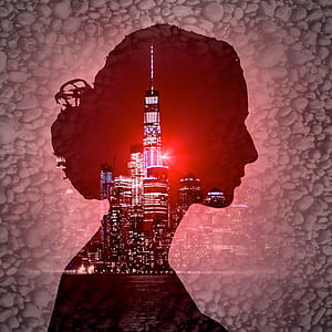 silhouette of woman and high rise buildings thumbnail