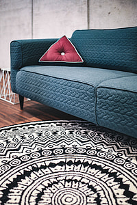 Blue sofa with pillows in a designer living room interior thumbnail