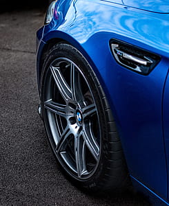 gray BMW 7-spoke vehicle wheel and tire in close-up photo thumbnail