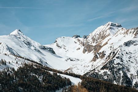 snow coated mountain at daytime thumbnail