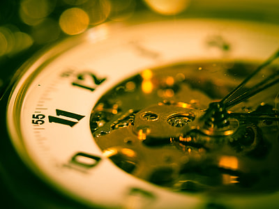 selective focus photography of mechanical watch thumbnail