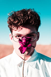 man behind pink rose thumbnail