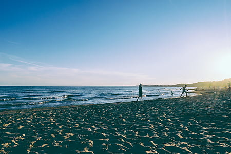 photo of two person walking on seashore thumbnail