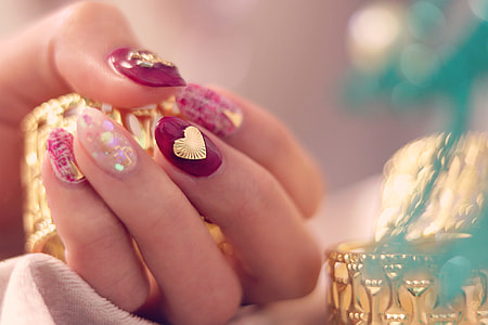 shallow focus photography of woman holding gold rings thumbnail