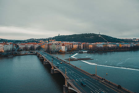 houses beside body of water and bridge thumbnail