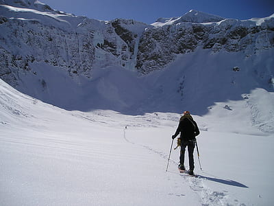 man walking in middle of snow thumbnail