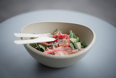 vegetable salad with fork and knife on selective focus photo thumbnail